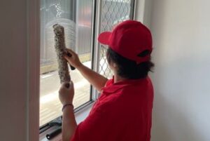 Cleaning the interior side of a window in a sunny room